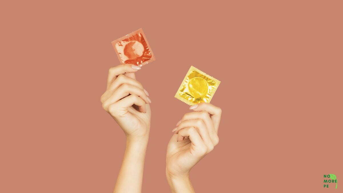 two hands with 2 condoms
