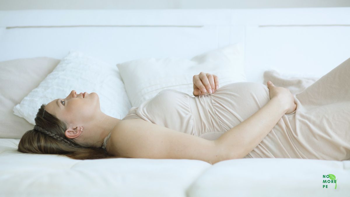 a pregnant women lying on bed