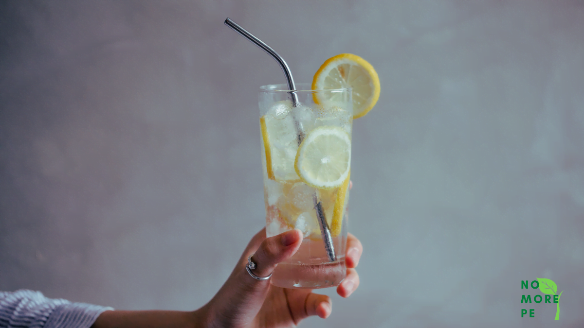 woman holding a lemonade glass